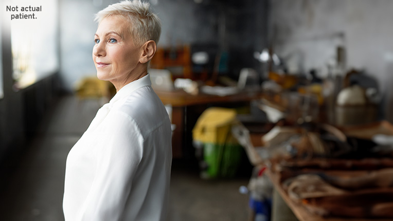 Woman with short hair looking outside confidently